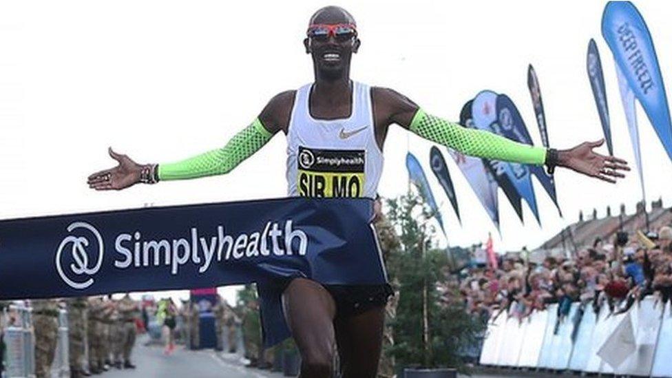 Sir Mo Farah crosses the finish line in the men's elite race