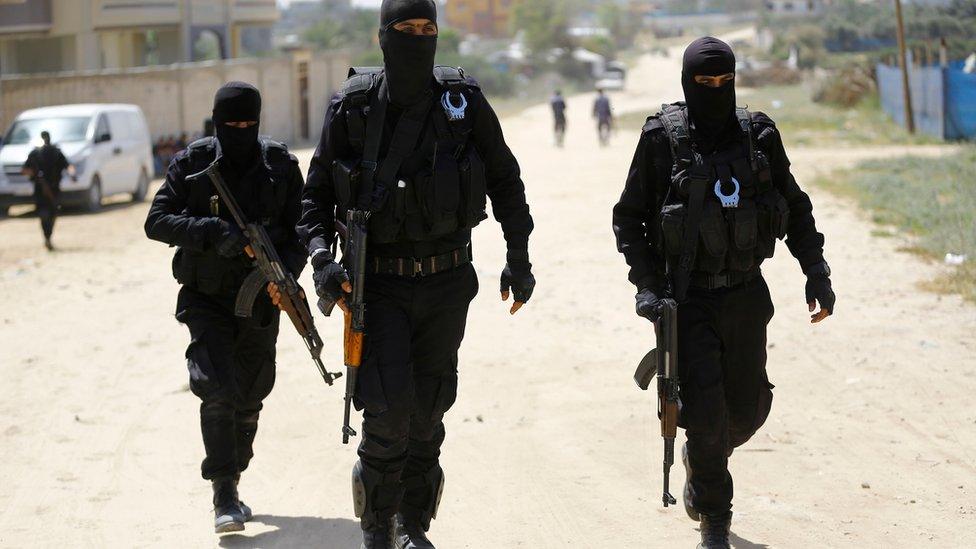 Hamas security forces carry out a raid in Nuseirat, south of Gaza City, on 22 March 2018