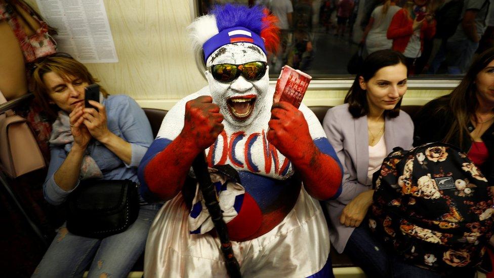 Soccer Football - World Cup - Moscow, Russia - June 20, 2018 Zomo, Russia"s fan from Cameroon is pictured in the metro