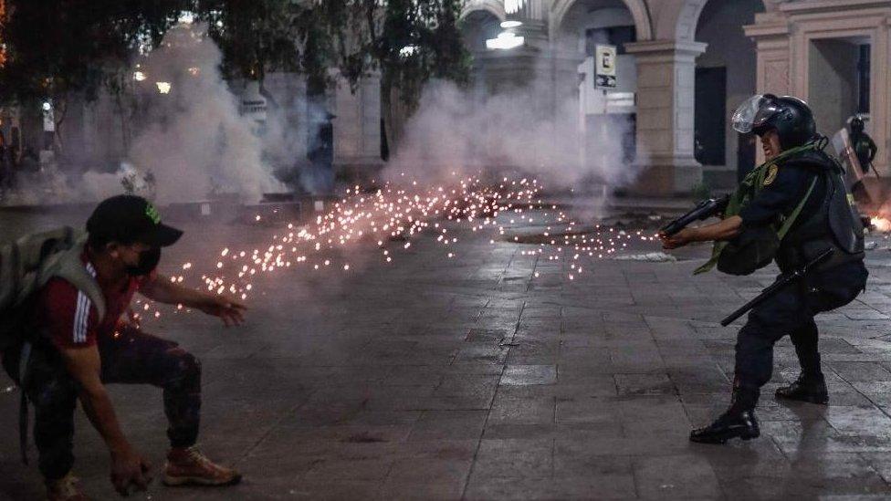 Protesters in favour of Pedro Castillo and against Congress, clash with members of the police in the streets of downtown in Lima, Peru, 11 December 2022.