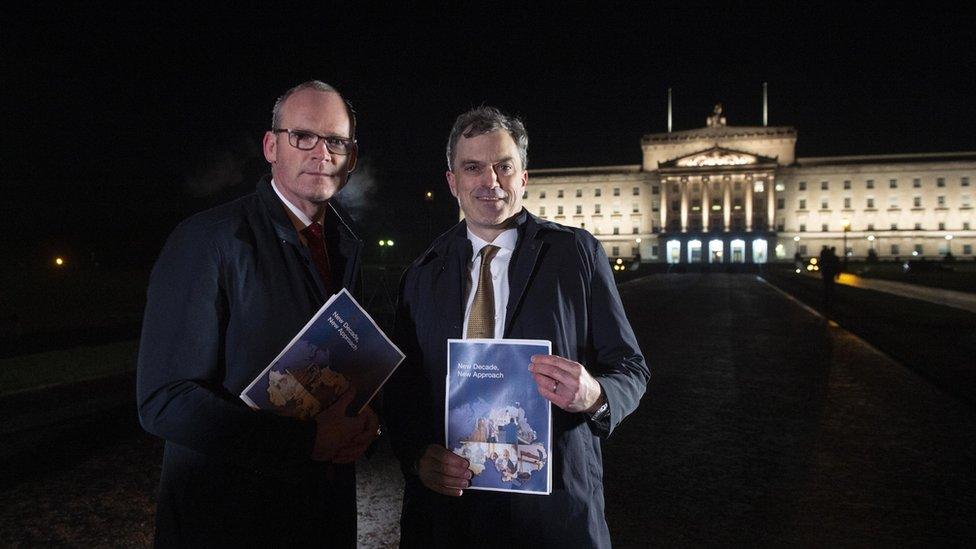 Julian Smith (R) and Irish Tanaiste Simon Coveney