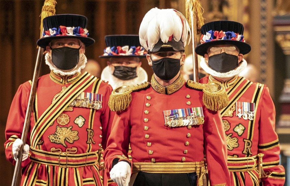 Masked Yeoman Warders march along the Royal Gallery during the ceremonial search of the Palace of Westminster in London