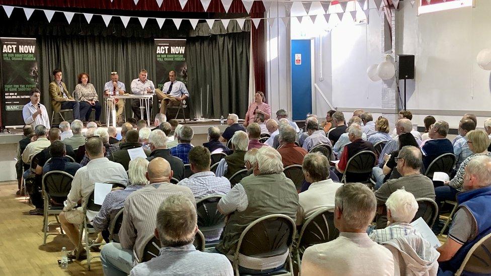 People sat in a hall for a meeting