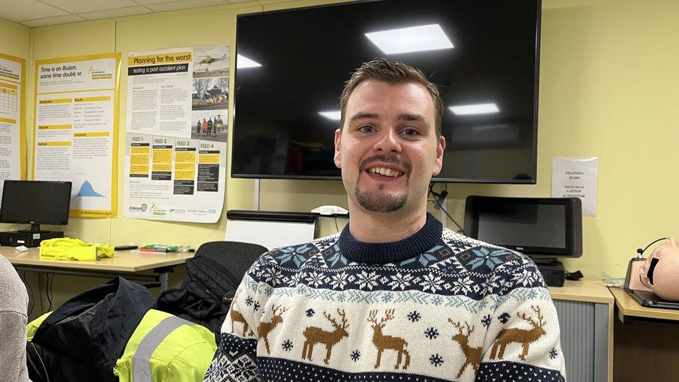 Daffyd Lee wearing a Christmas jumper