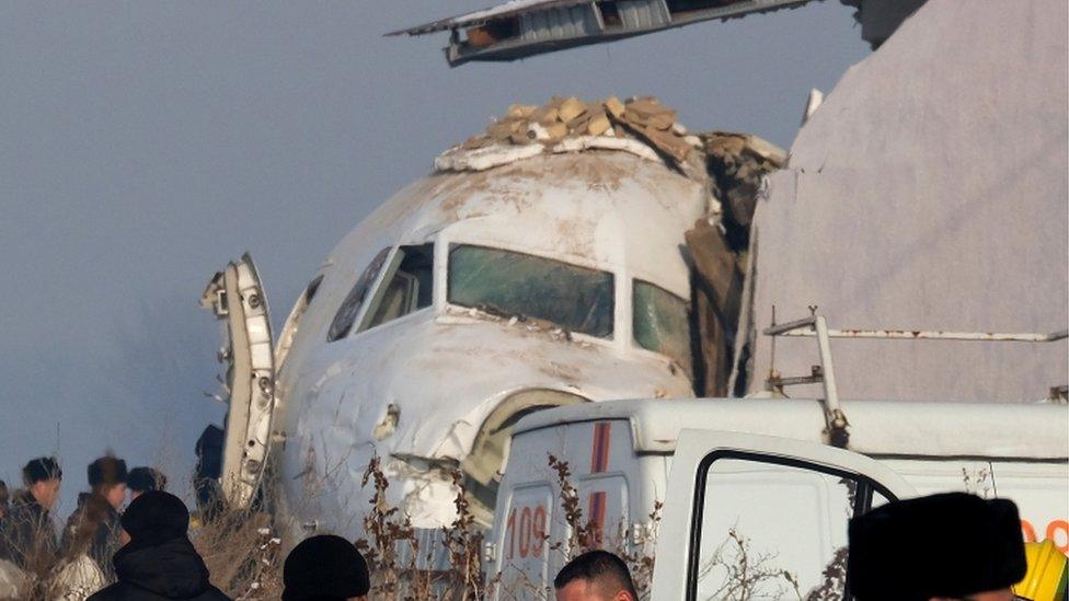 Plane resting next to building in Almaty Kazakhstan