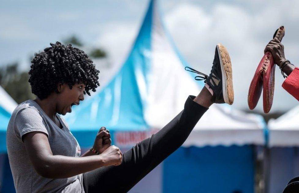 A woman performs taekwondo in Nairobi, Kenya