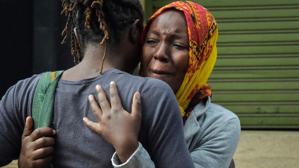 People grieving in Nairobi, Kenya in the aftermath of the terror attack on the Dusit compound