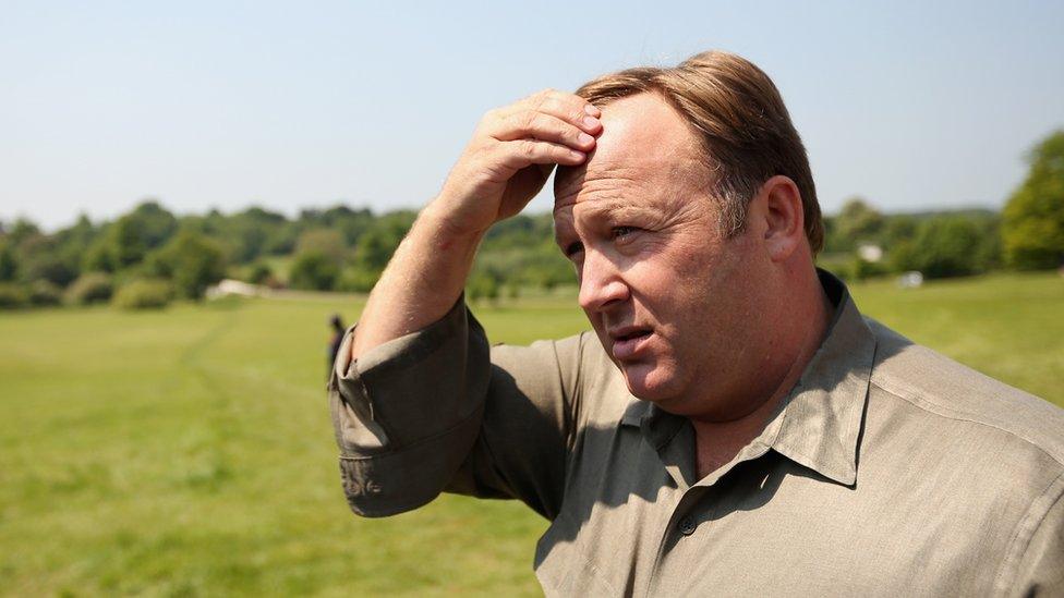 Alex Jones scratching his head - 2013