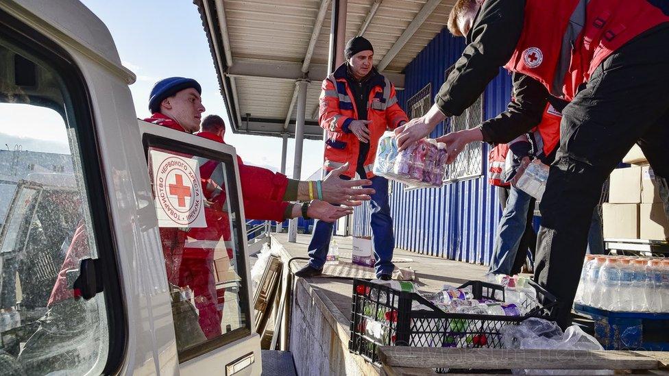 Volunteers loading donations