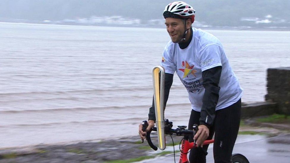 Wales rugby legend Ryan Jones cycles the baton in Swansea