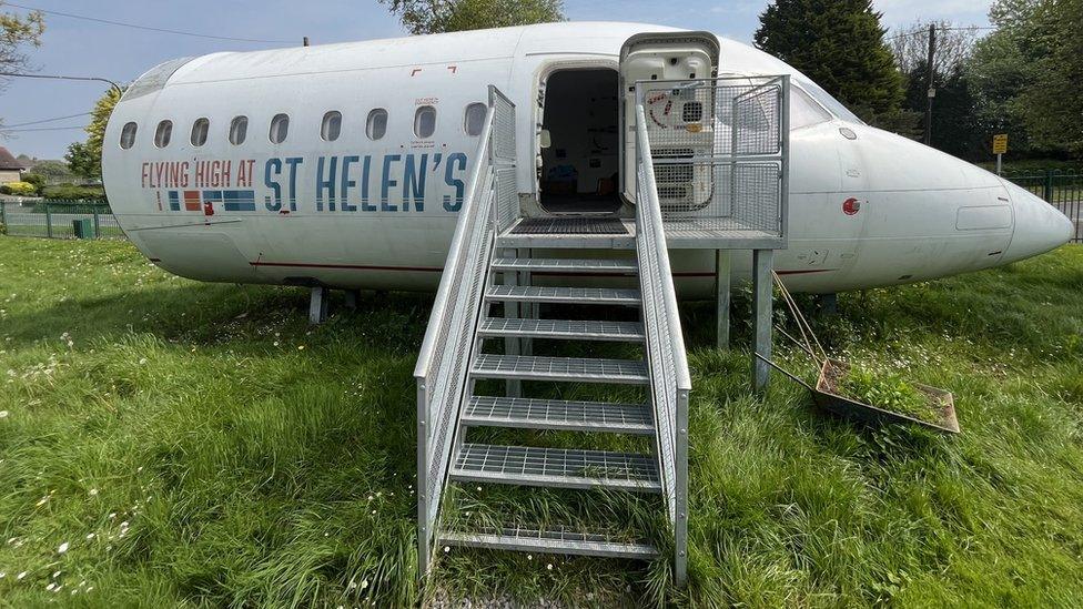 The fuselage with steps going into it