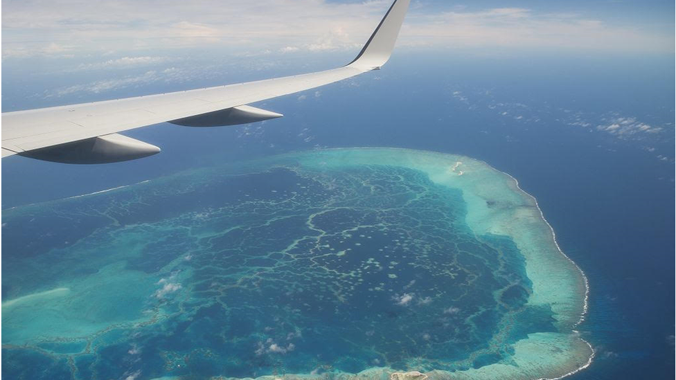 An aerial view of midway atoll from a plane