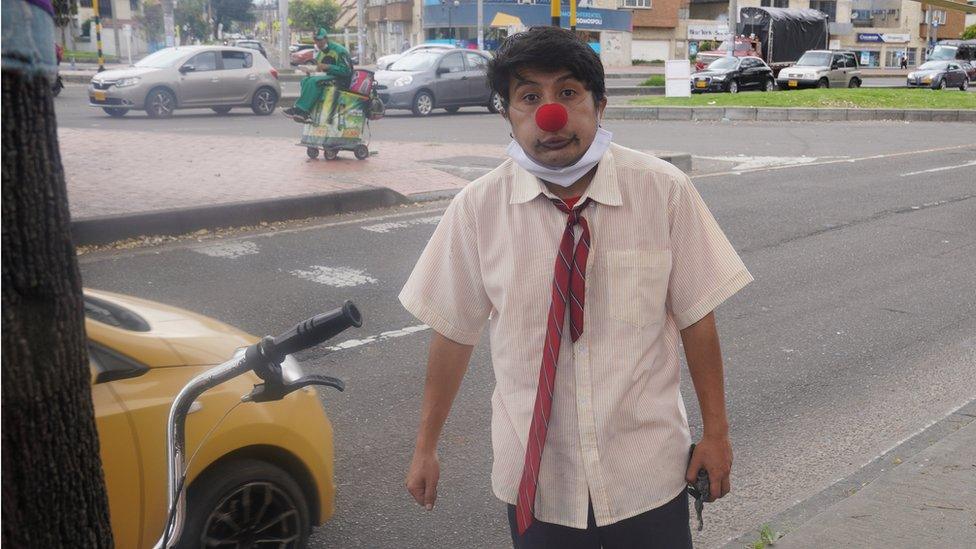 Manuel David Cañas works as a clown entertaining drivers stopped at traffic lights