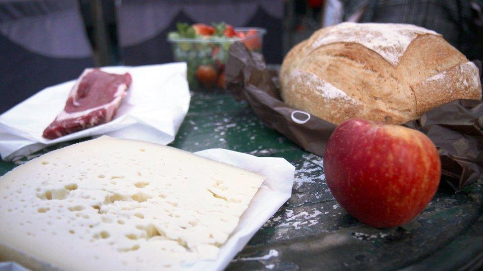 Cheese, steak, apple, strawberries and bread