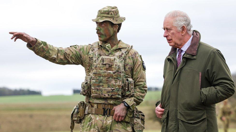 King Charles III meets Major Tony Harris ahead of a trench attack and defence simulation