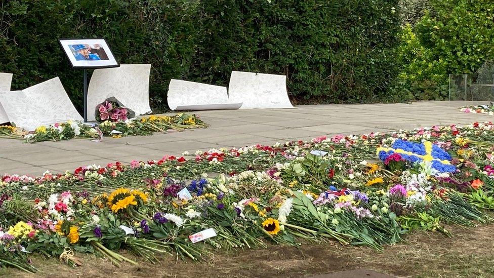 Floral tributes have been left outside