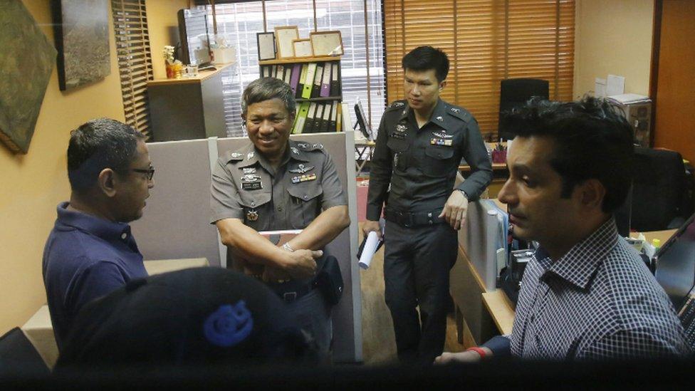 Human Rights Watch staff talk to policemen at the Foreign Correspondents Club of Thailand in Bangkok - 26 June 2015