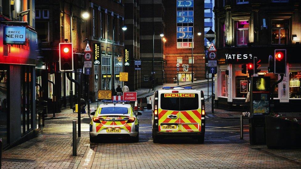 Police vans in a city centre