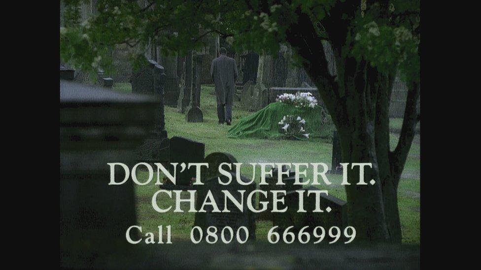 A man walking away from his sons grave in a NIO advert promoting the Confidential Telephone Line