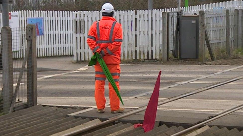 Guard at level crossing