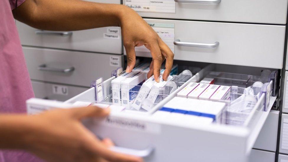 A cabinet filled with medicine