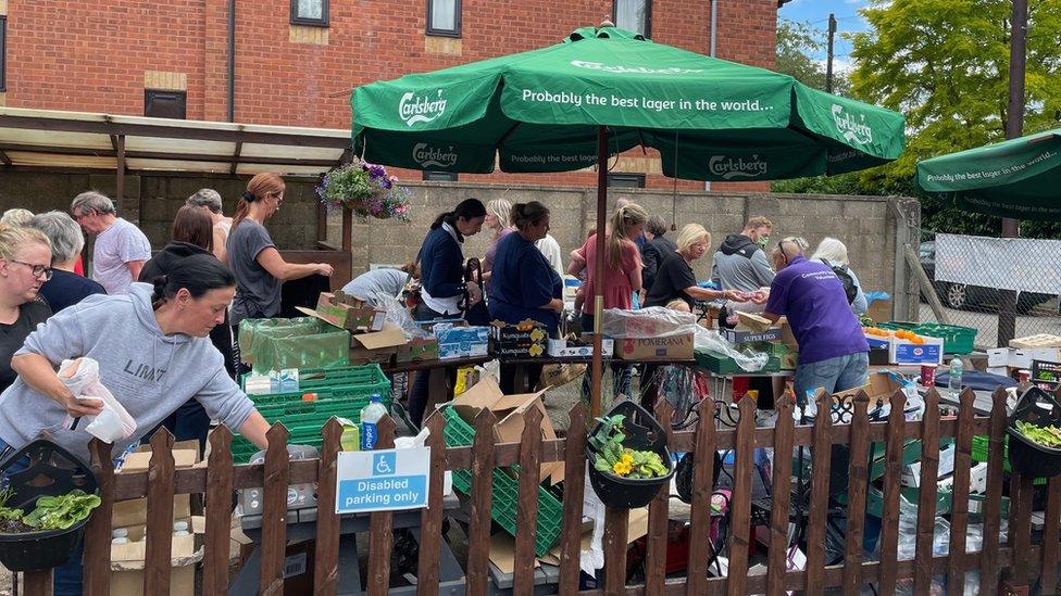 Community larder where people are collecting food.