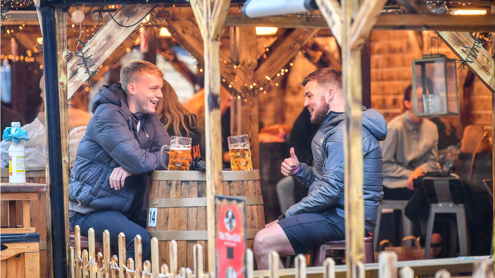 Two people drinking in Cardiff