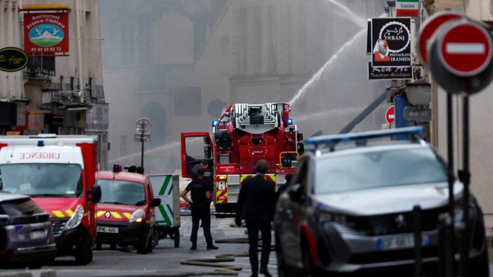 Police and firefighters at the scene of the explosion