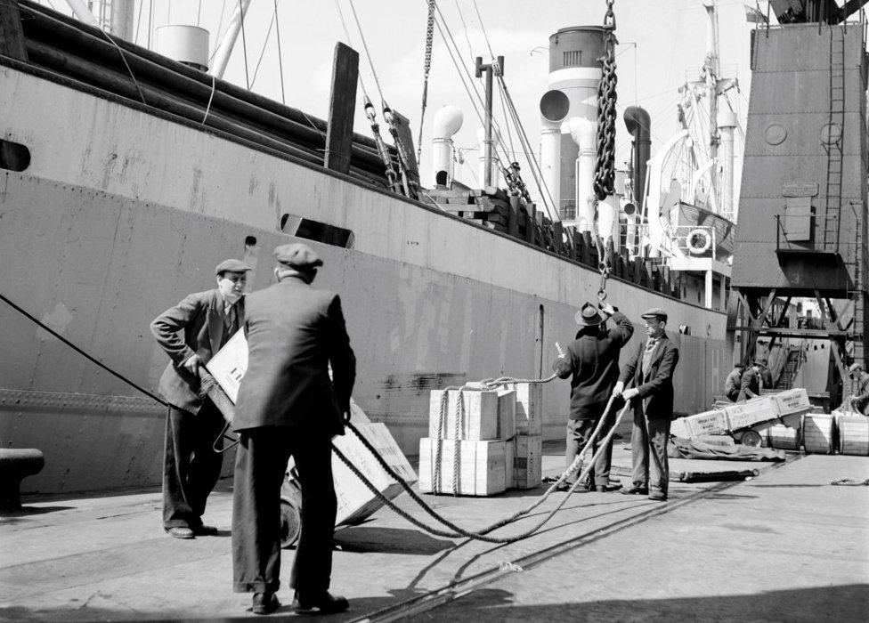 Loading a ship at the North Quay, West India Docks, London, c1945-c1965