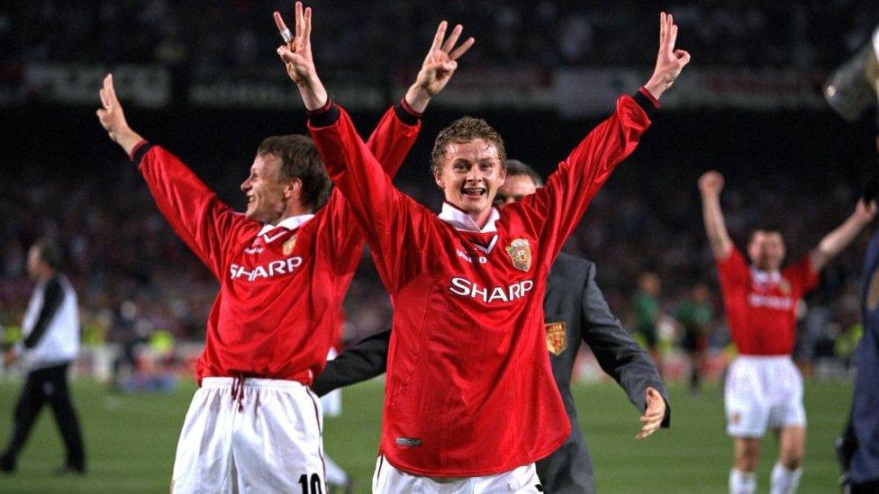 Match goalscorers Teddy Sheringham and Ole Gunnar Solskjaer of Manchester United celebrate with a treble salute after the UEFA Champions League Final between Bayern Munich v Manchester United at the Nou camp Stadium on 26 May, 1999 in Barcelona, Spain.