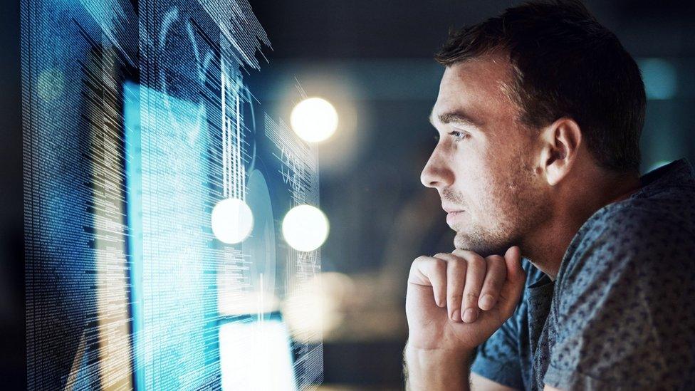 Man reading information on a screen