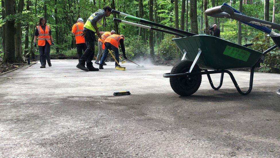 Volunteers working at the site of a hut base