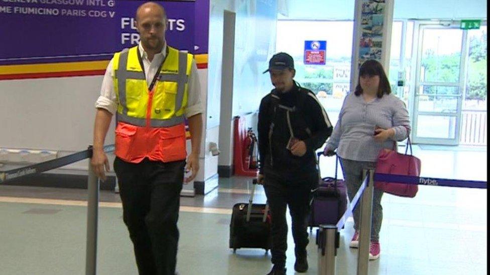 Jacques and Olivia of the Hijinx theatre pretend to be tourists to train airport staff in dealing with learning disabled customers