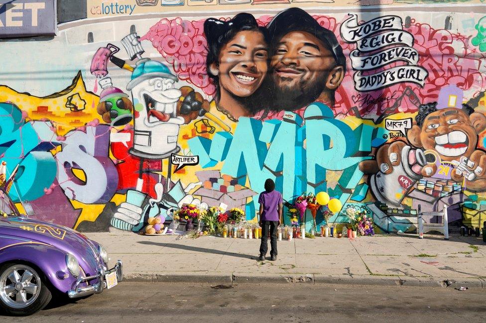 Fans gathered at a mural to pay respects to Kobe Bryant after a helicopter crash killed the retired basketball star, in Los Angeles, California, 28 January 2020.