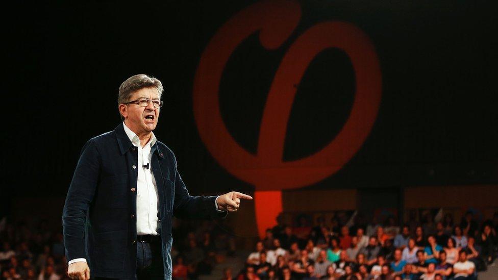 Jean-Luc Mélenchon gestures as he delivers a speech during a campaign rally on March 29, 2017 in Le Havre