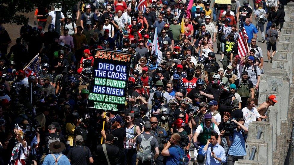 Right-wing supporters of the Patriot Prayer group march during a rally in Portland, 4 August