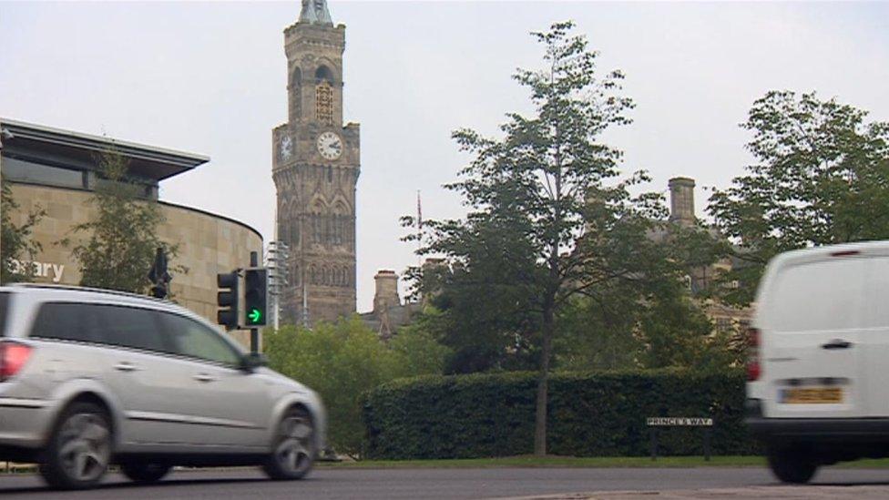 Cars driving down a main road in Bradford