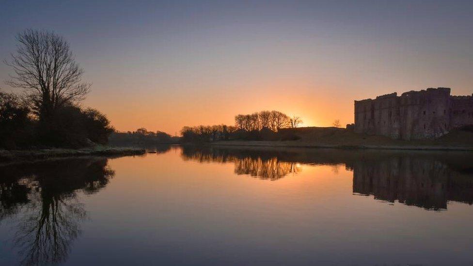 Sunrise over Pembrokeshire's Carew Castle