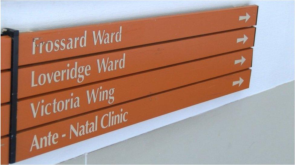 Sign in the Princess Elizabeth Hospital pointing to the Loveridge Ward, the maternity ward