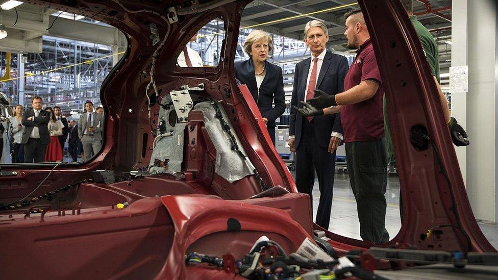 Theresa May and Philip Hammond at Jaguar Land Rover factor in Solihull