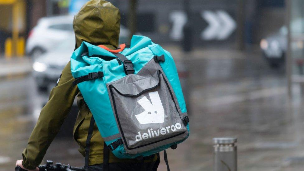 Deliveroo rider in the rain