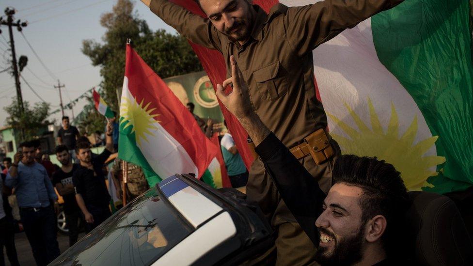 People celebrate on the streets after voting in a referendum on Kurdish independence in Kirkuk, Iraq (25 September 2017)