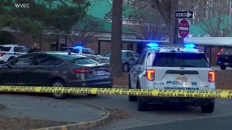 Police vehicles are seen parked outside Richneck Elementary School