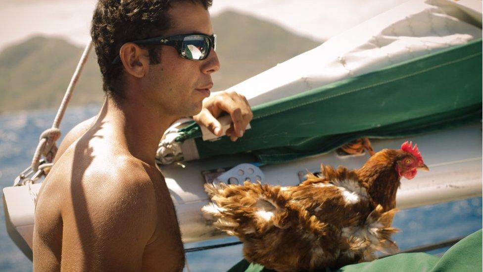 Guirec Soudee and MOnique the hen on board a boat