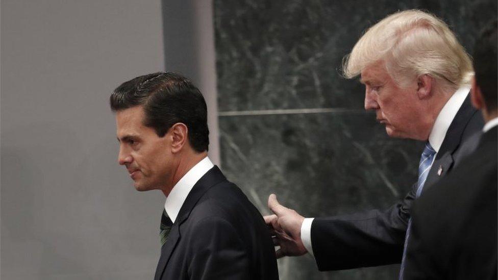 - In this Aug. 31, 2016 file photo, Republican presidential nominee Donald Trump walks with Mexico President Enrique Pena Nieto at the end of their joint statement at Los Pinos, the presidential official residence, in Mexico City. Trump called his surprise visit to Mexico City a "great honour."