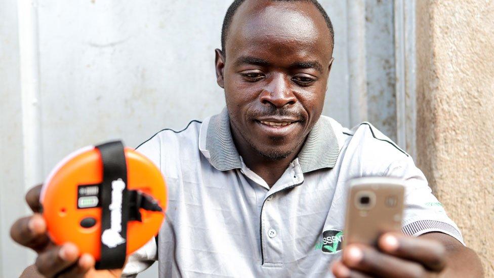 Rwandan man with charger