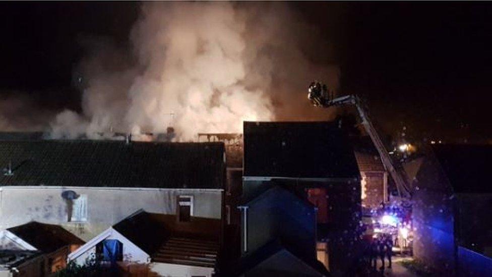 Large plumes of smoke coming from the house fire in Lombard Street, Neath