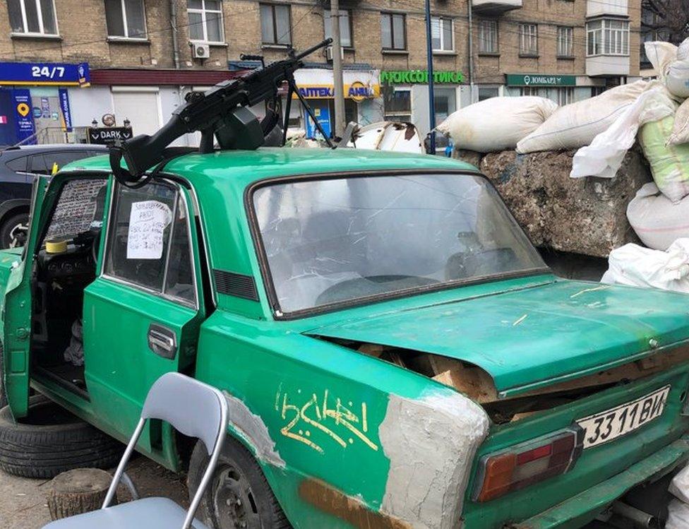 A car positioned at a roadblock in Kyiv