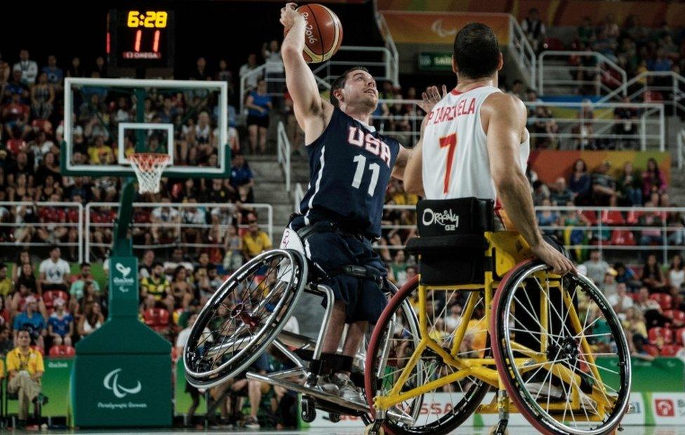 USA's Steve Serio (L) competes with Spain's Pablo Zarzuela during men's final of wheelchair basketball