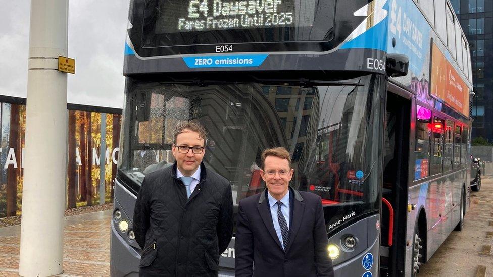 David Bradford and Andy Street in front of a bus